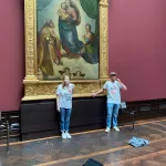 Two people from the climate protest group Letzte Generation glued their hands to the golden frame of the painting