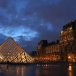 PARIS, FRANCE - MARCH 05: The Louvre museum is pictured at dusk on March 05, 2024 in Paris, France. (Photo by Pascal Le Segretain/Getty Images)