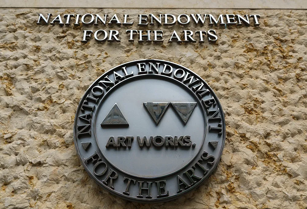 WASHINGTON, DC - JUNE 1: A logo for the National Endowment for the Arts (NEA) is displayed outside of its headquarters at Constitution Center on June, 2025 in Washington, DC. (Photo by Kevin Carter/Getty Images)