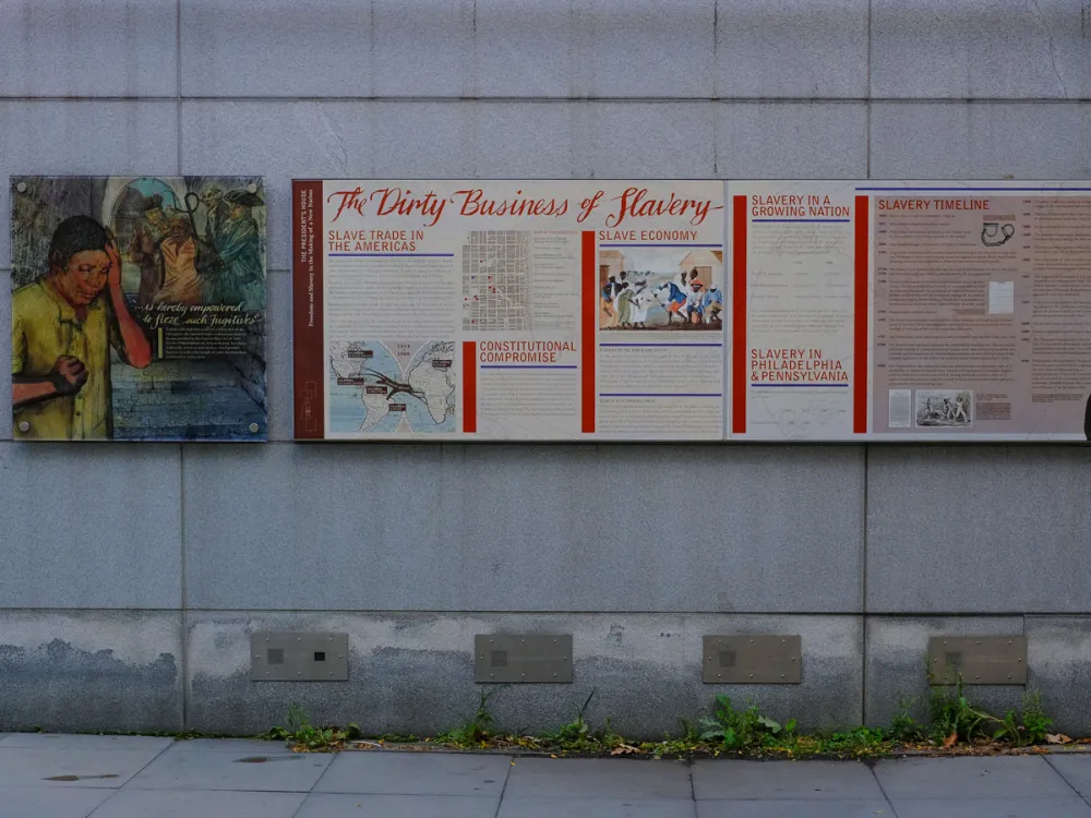 Signage about slavery is displayed on an outdoor exhibit at Independence National Historical Park in Philadelphia, Pennsylvania, on October 24, 2025. (Photo by Michael Yanow/NurPhoto via Getty Images)