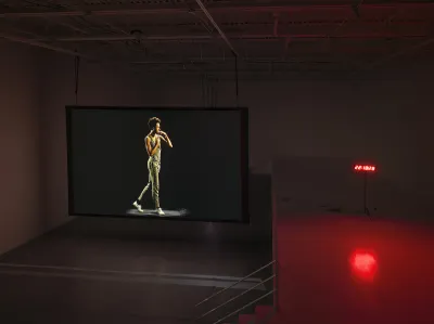 A screen displaying a person walking next to a countdown clock.