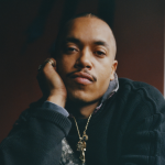 A man resting his head on his hand.