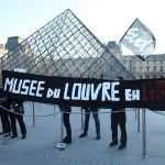 PARIS, FRANCE - DECEMBER 15: Museum staff stage a protest as workers voted to go on strike against increasingly deteriorating working conditions and security vulnerabilities at Louvre Museum in Paris, France on December 15, 2025. (Photo by Mohamad Salaheldin Abdelg Alsayed/Anadolu via Getty Images)