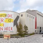 A museum exterior with a large sign reading 