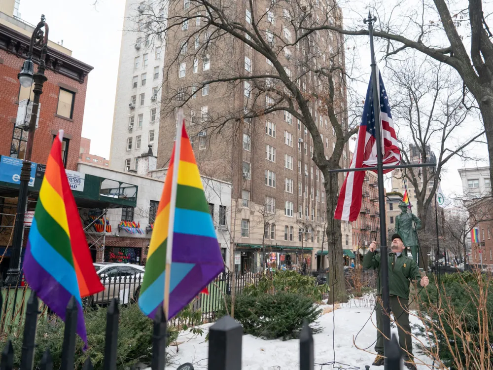 A National Park Service employee raises a U.S. flag at the Stonewall National Monument in Manhattan, New York, on Wednesday, Feb. 11, 2026. (Barry Williams/New York Daily News/Tribune News Service via Getty Images)