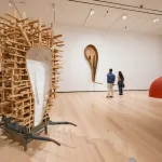 A gallery with abstract sculptures in it.