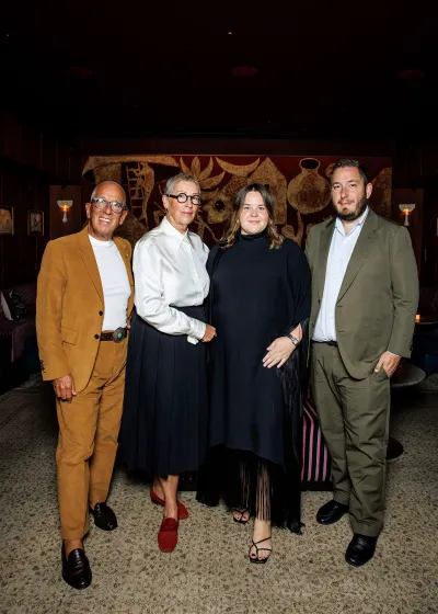 Portrait of Simon, Catriona, Brielle, and Angus Mordant at a bar. 