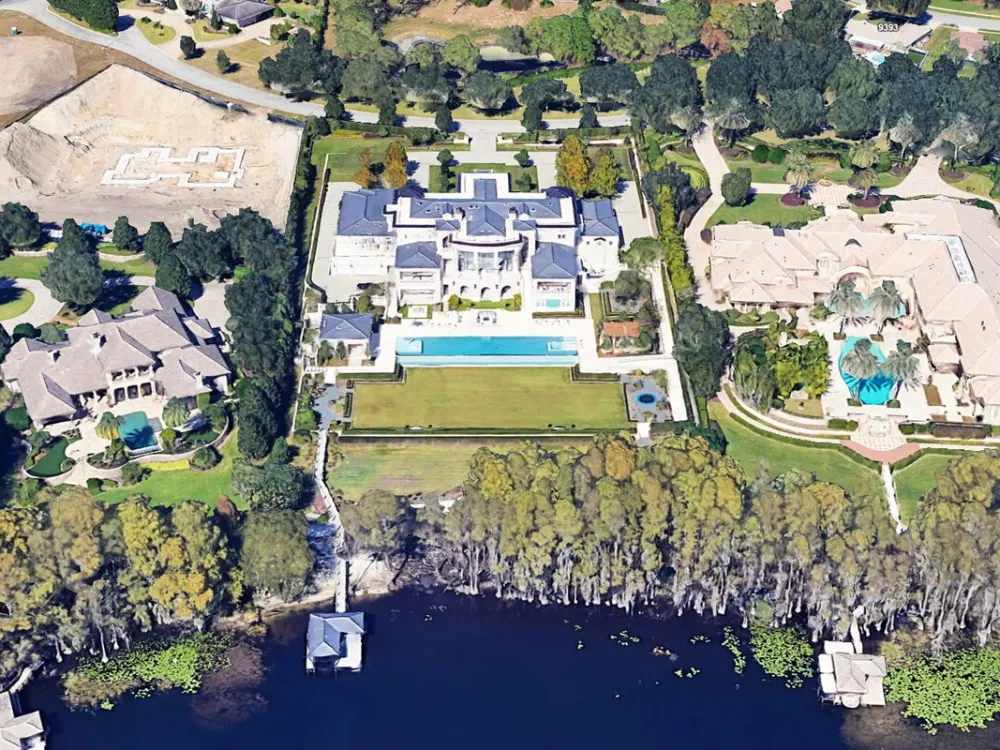 An overhead view of a large oceanfront estate.