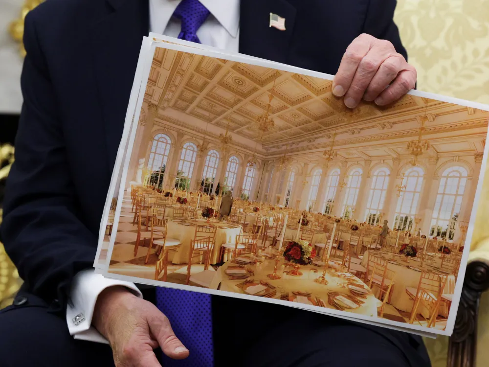 WASHINGTON, DC - OCTOBER 22: U.S. President Donald Trump displays a rendering of his proposed 0 million White House ballroom as he meets with NATO Secretary General Mark Rutte in the Oval Office of the White House on October 22, 2025 in Washington, DC. Less than a week after hosting Ukrainian President Volodymyr Zelensky, Trump is meeting with Rutte to discuss the war in Ukraine. (Photo by Alex Wong/Getty Images)