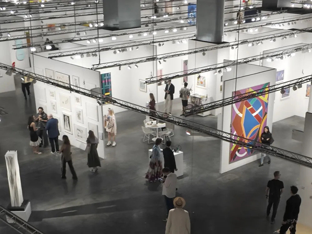 Aerial view of an art fair in a convention center.