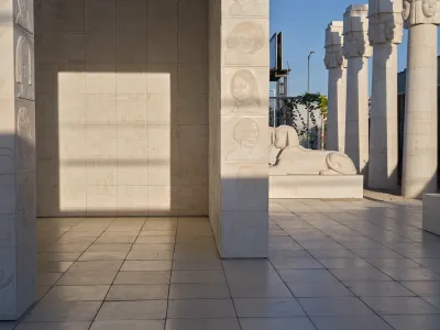 A concrete structure carved with images of people