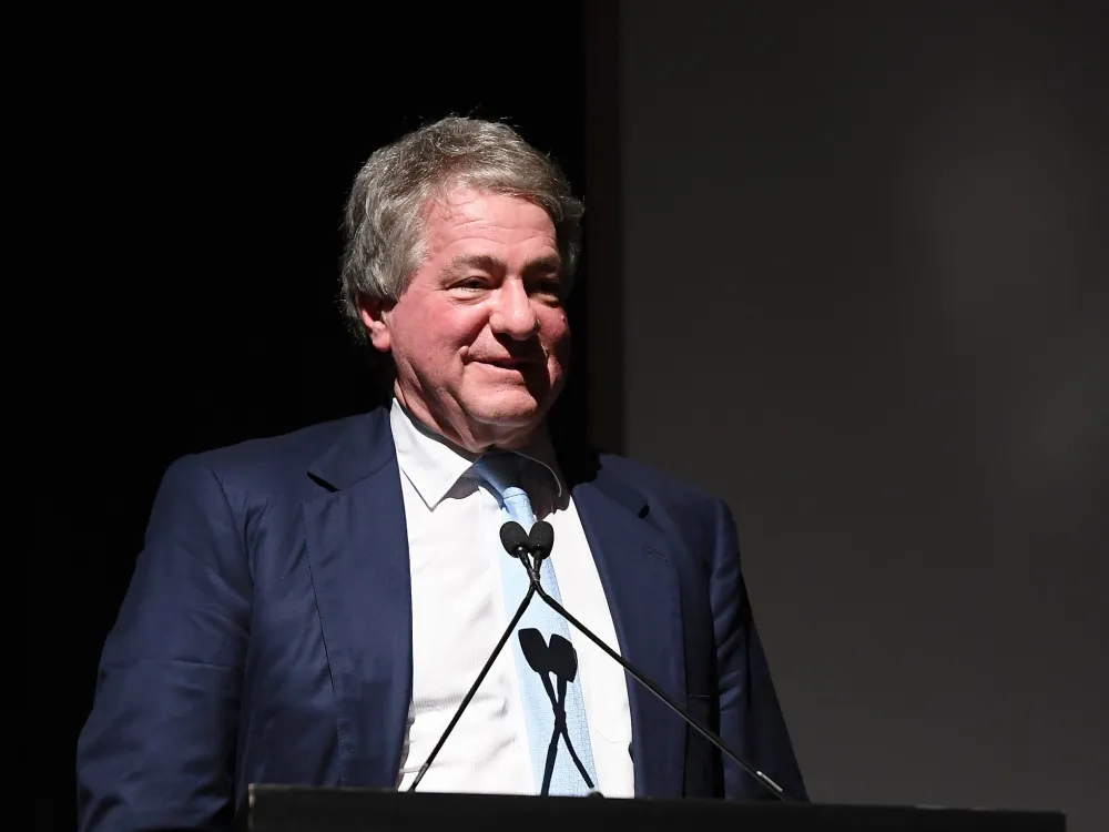 Portrait of Leon Black standing at a podium.