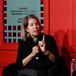 A woman with a microphone.