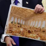 President Donald Trump displays a rendering of his proposed White House ballroom during a meeting with NATO Secretary General Mark Rutte in the Oval Office of the White House on October 22, 2025