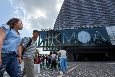 HONG KONG, CHINA - MARCH 18: Pedestrians walk past the Hong Kong Museum of Art on March 18, 2026, in Hong Kong, China. Visitors gather outside the museum in Tsim Sha Tsui as it continues to receive tourists and local school groups in the city