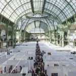 A Birds Eye view of a maze-like art fair held under a magnificent arched glass ceiling.