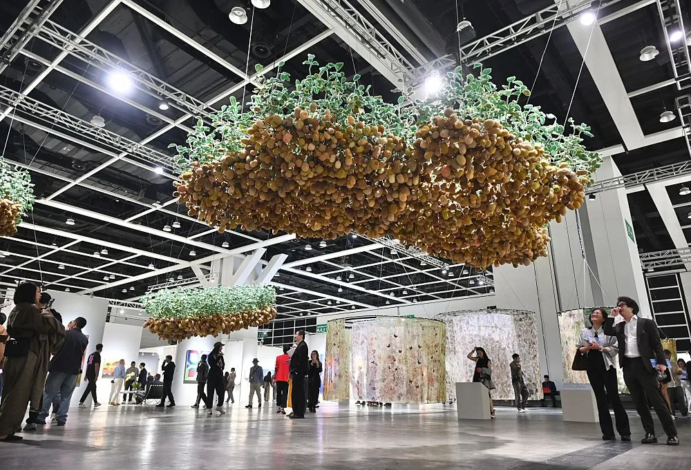 HONG KONG, CHINA - MARCH 25: People visit artworks during the previews of Art Basel Hong Kong 2026 at the Hong Kong Convention and Exhibition Centre (HKCEC) on March 25, 2026 in Hong Kong, China. (Photo by Li Zhihua/China News Service/VCG via Getty Images)