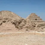 A step pyramid in a desert.
