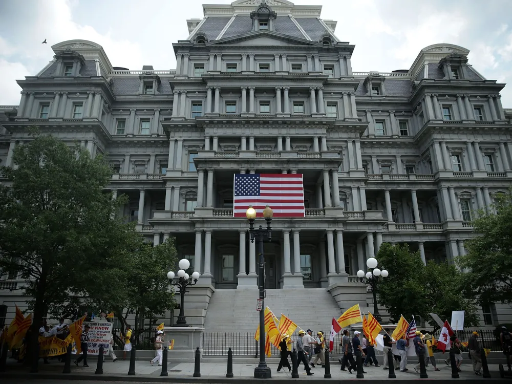 Vietnamese-American activists march outside Eisenhower Executive Office Building of the White House as U.S. President Barack Obama meets with General Secretary Nguyen Phu Trong of the Communist Party of Vietnam in the Oval Office July 7, 2015 in Washington, DC. The activists protested against the Community Party of Vietnam and called for human rights in the country. (Photo by Alex Wong/Getty Images)