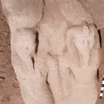 rough stone statue showing ramses II formed in sandstone