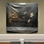 A painting covered with plastic