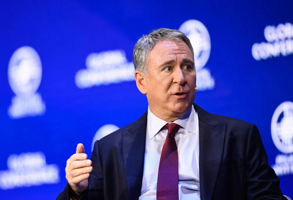 Man speaking at conference.