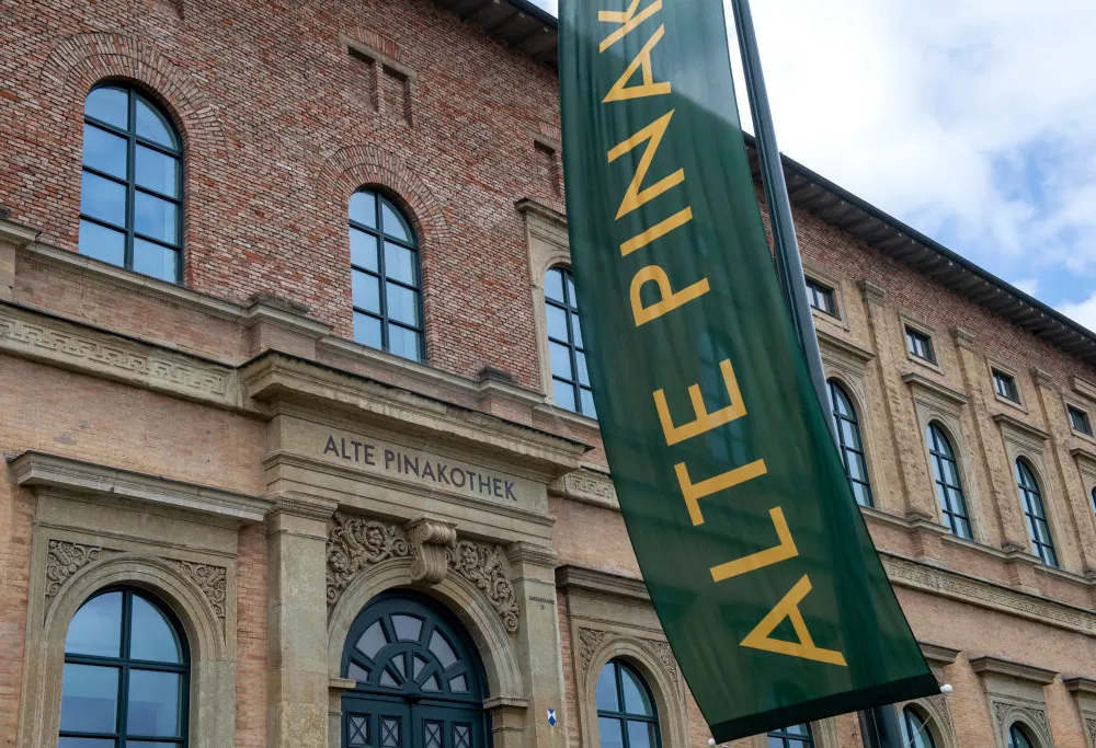 A red brick building and green banner.
