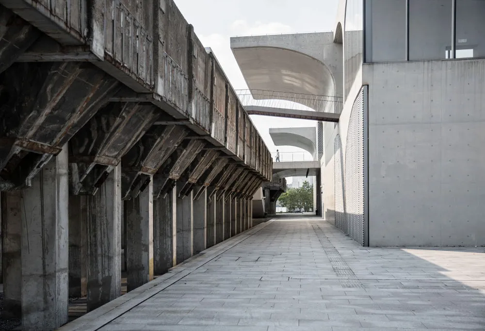 A long uncovered cement walkway.