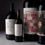 An image showing the labels of four artfully designed wine bottles of different sizes.