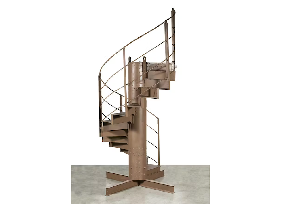 A segment of spiraling staircase on a white background.