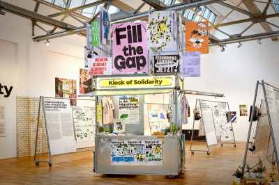 An installation composed of a large display with signs such as 