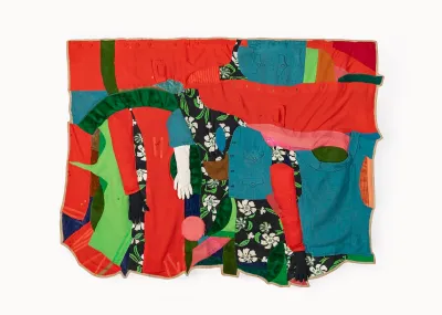 A textile with various garments sewn together.