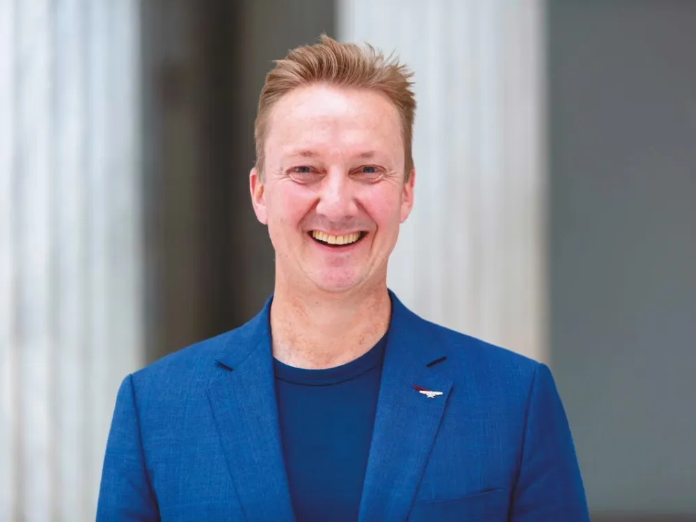 Portrait of Janne Sirén in a blue suit.