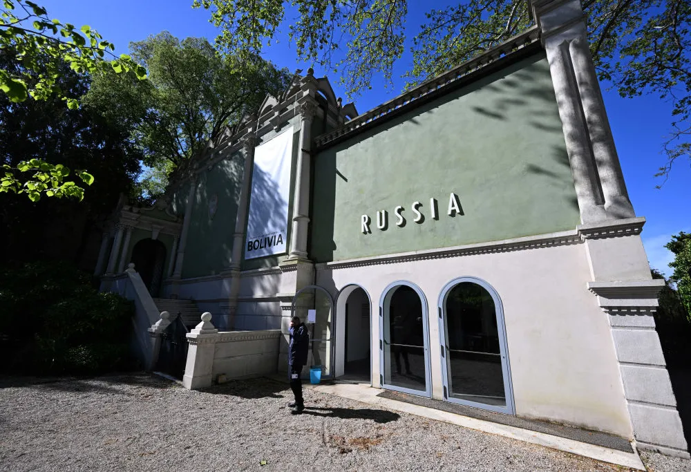 exterior of a building with a green facade that says 
