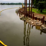 A construction site along a river bank.