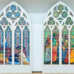 Few of two large-scale designs of a figurative scenes of the Pentecost. They are arranged as they would be when installed in a catherdral window.
