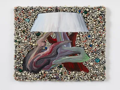 A painting of a lampshade attached to twists of color and set against a background studded with rhinestones.