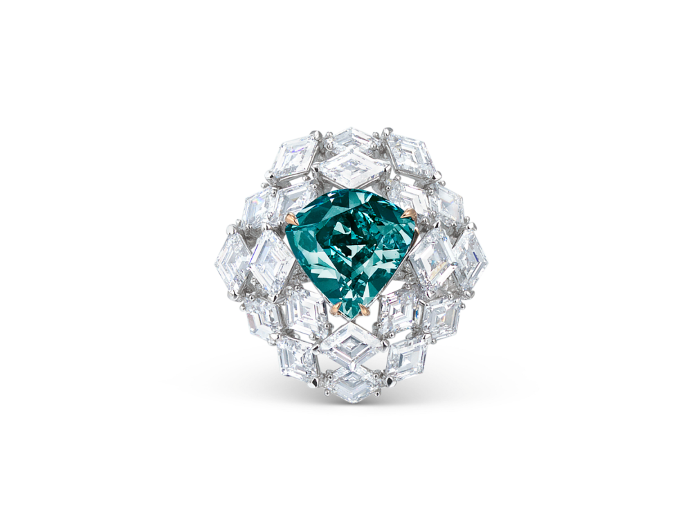 a blue-green diamond ring surrounded by diamonds