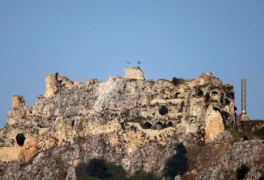 TOPSHOT - An Israeli flag flies over the medieval Beaufort Castle, known locally as Qalaat al-Shaqif or Shaqif Arnoun, as seen from the Marjayoun area of southern Lebanon on May 31, 2026. Israeli Defense Minister Israel Katz said on May 31 that the army had seized the medieval fortress of Beaufort, in southern Lebanon, where it has expanded its operations against the pro-Iranian Hezbollah.