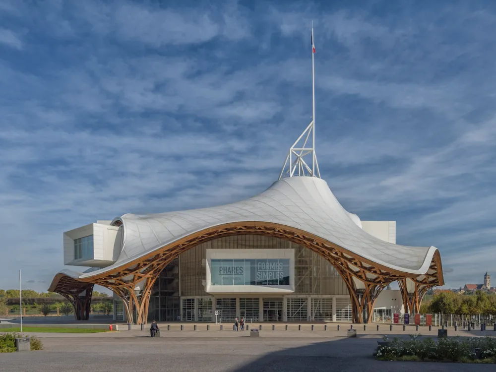 A museum whose roof is white and wavy.
