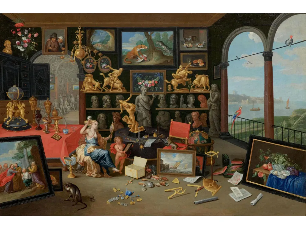 A dense kunstkammer painting showing sculptures and 17th-century paintings in a studio with a model who looks out at a Flemish landscape with views of the water.