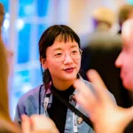 A smiling Asian woman.