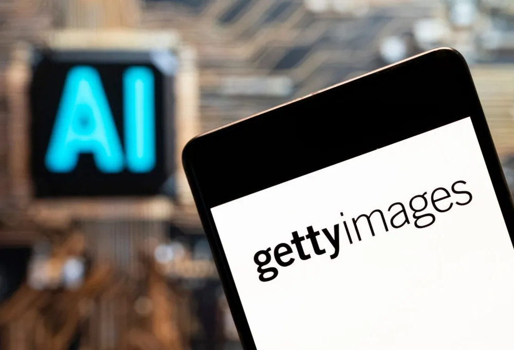 A tablet displaying the Getty Images logo next to a blurry sign reading
