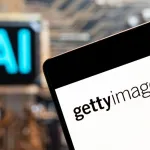 A tablet displaying the Getty Images logo next to a blurry sign reading