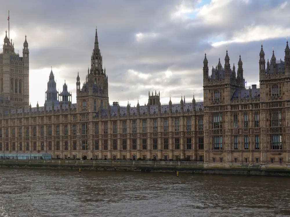 The Gothic Revival architecture of the Palace of Westminster stands along the River Thames in London, England, United Kingdom, on December 24, 2025. This historic landmark serves as the seat of the Parliament of the United Kingdom, featuring the Victoria Tower and the long river-facing facade of the House of Commons and House of Lords (Photo by Michael Nguyen/NurPhoto via Getty Images).