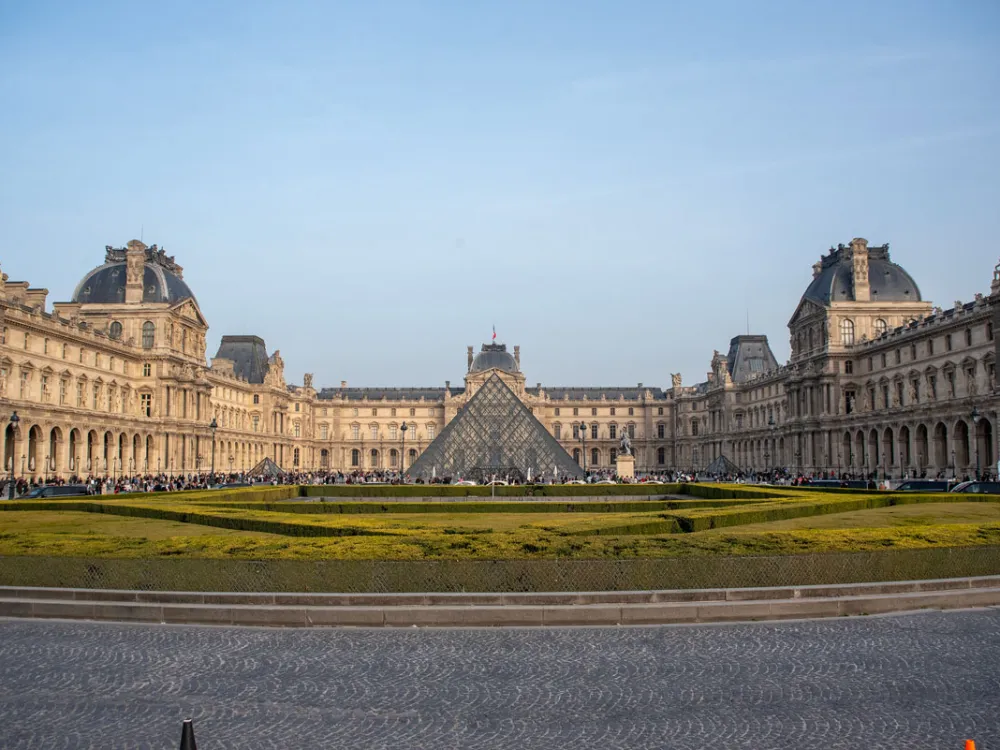 PARIS, FRANCE - 2026/03/07: View of the Louvre Pyramid and the Louvre Museum in Paris. The Louvre Pyramid is a masterpiece of 20th-century architecture that serves as the main entrance to the Louvre Museum in Paris. Paris, France