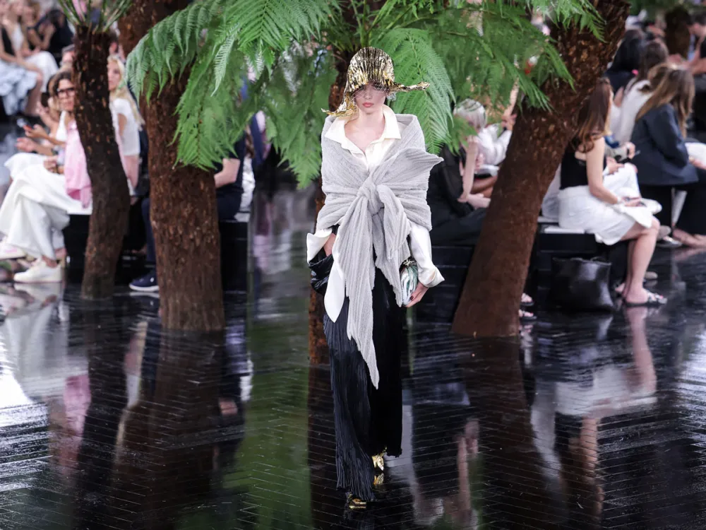 A model presents a creation for Christian Dior for the Women Haute Couture Fall/Winter 2026-2027 collection as part of the Paris Fashion Week, in Paris, on July 6, 2026. (Photo by Kenzo TRIBOUILLARD / AFP via Getty Images)
