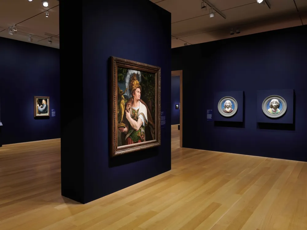 An art gallery displays paintings and sculptures.
