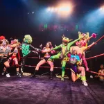 A group of wrestlers in a ring.