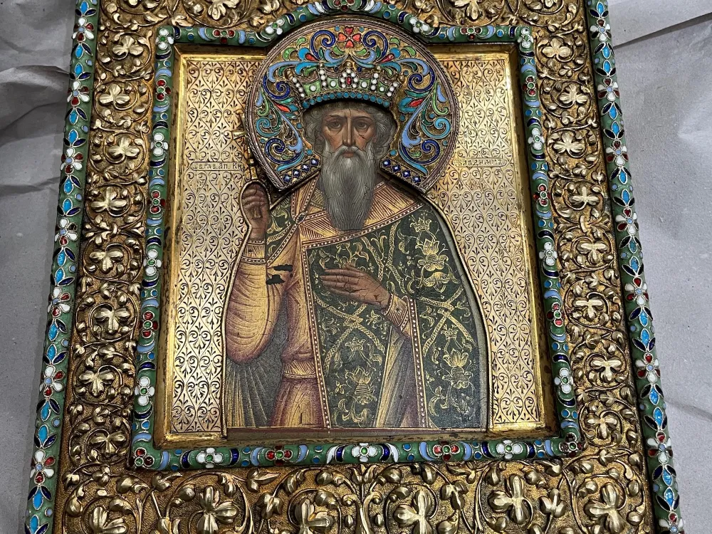 A Russian icon shows a bearded man with his right hand raised
